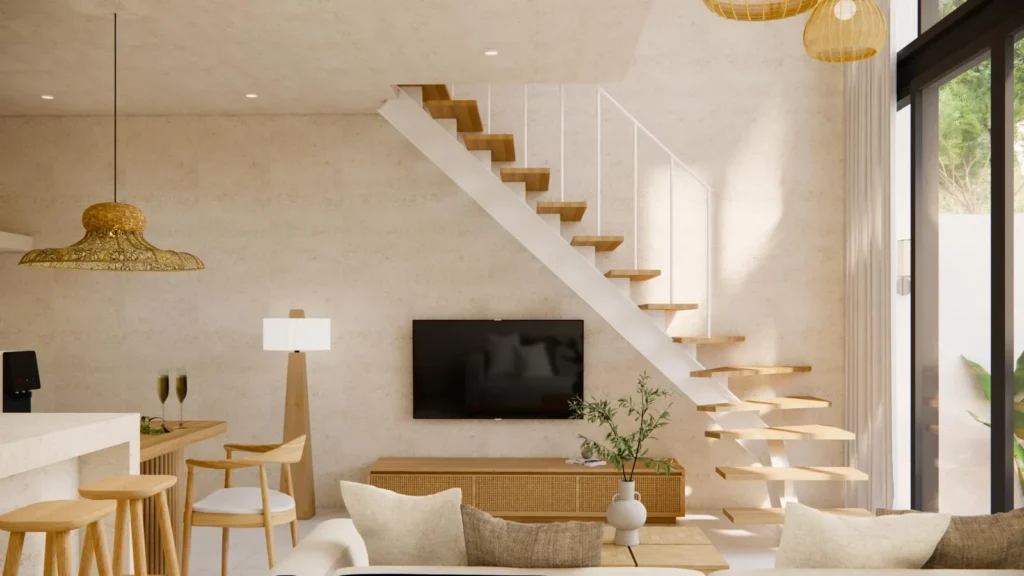 Double-height living room opening onto the private courtyard and pool of a Kuta villa studio for sale